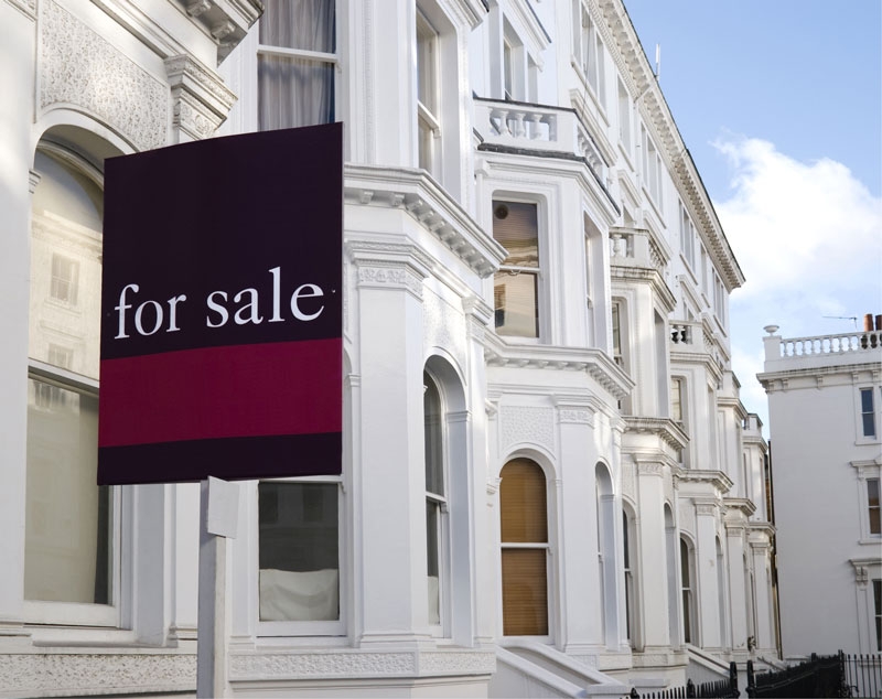 house with a for sale sign outside to denote a story about house prices