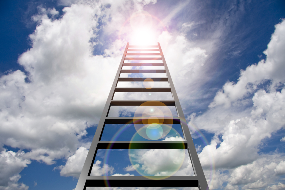 property ladder reaching into a blue sky to denote housing