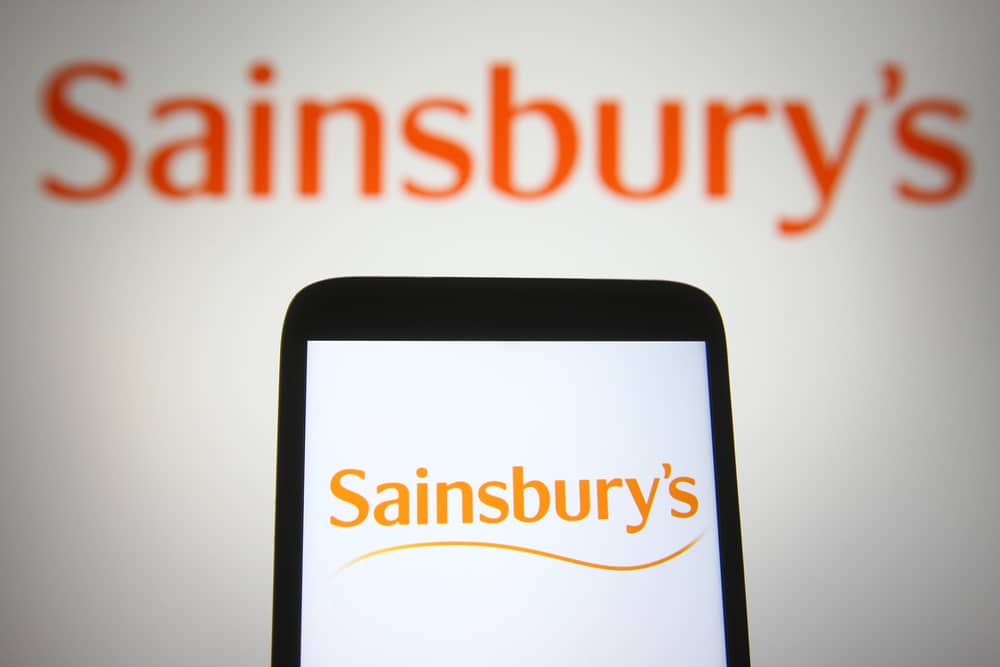 Photo of a phone with Sainsbury's app to denote Sainsbury's buy now, pay later scheme Klarna