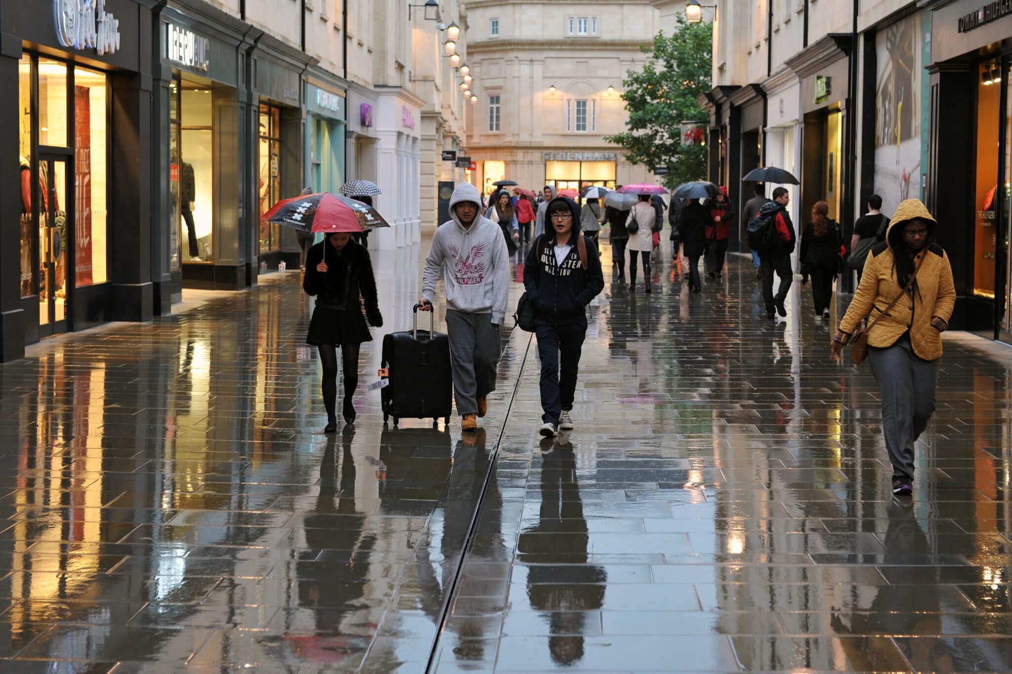 photo of a rainy high street to denote low retail sales in June