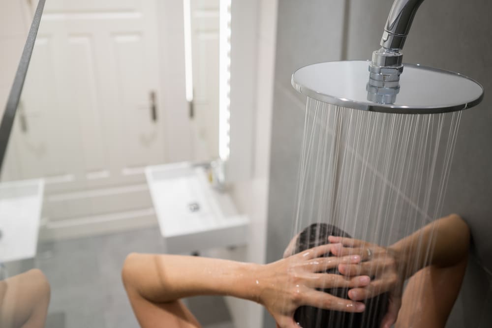 a person in a shower to denote water bills being set to rise