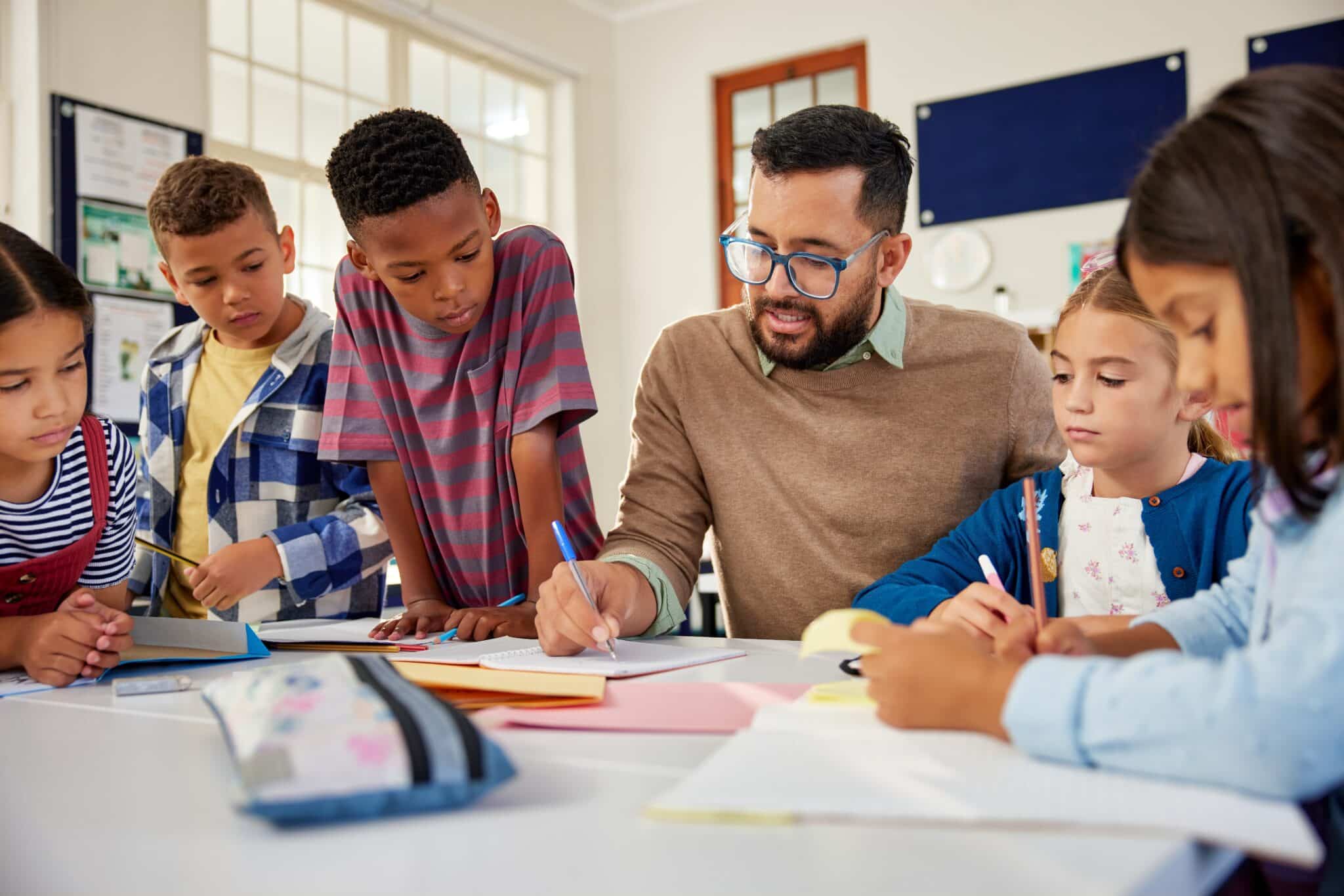 Photo of a classroom with a teacher to denote a back to school guide on creating a launch fund