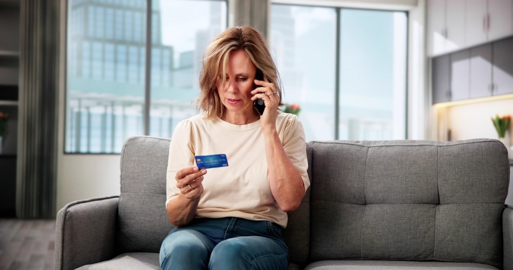 A concerned retiree on the phone to denote a story on the winter fuel payment scam