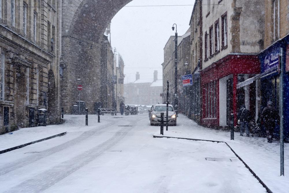 Image of a snowy road to denote snow disruption workers rights