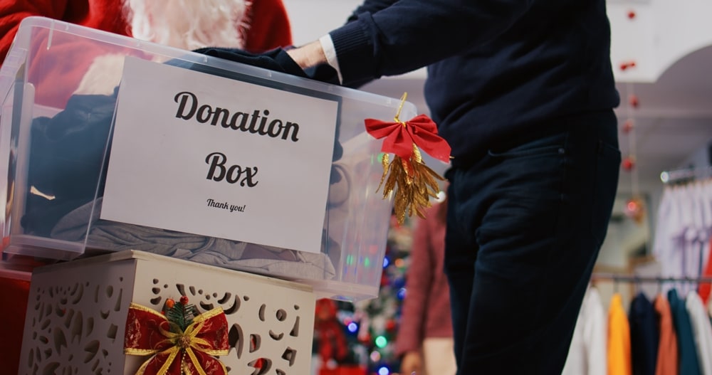 image of a donations box in a charity shop to denote second hand christmas gifts popularity