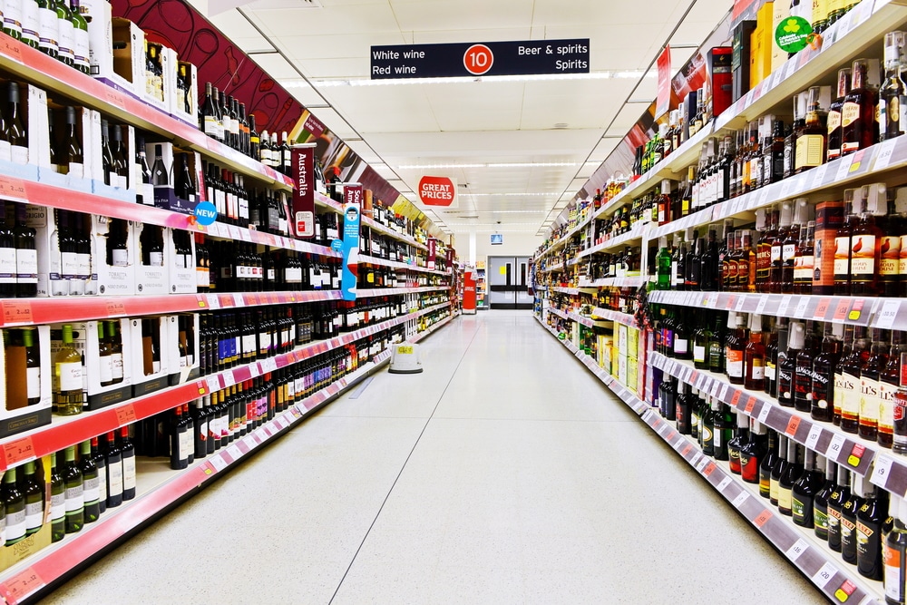 an empty supermarket aisle to denote retail sales dropping in December